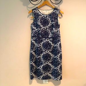 Knee length white/navy dress by Biden. Size 6. EUC